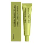 A green cosmetic tube labeled 'Vitamin C Booster Shot' stands beside its matching rectangular box on a plain white background.